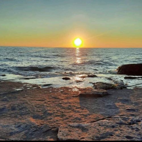 Another stunning Lake Huron sunset from The Rocks—where golden skies meet timeless stone.