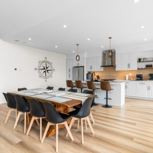 The open-concept dining and kitchen area is perfect for gathering over meals.