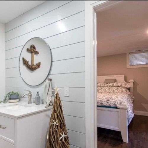 Clean and updated bathroom with modern finishes and cottage charm.