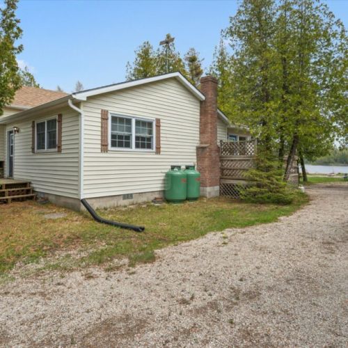 Enjoy easy access to the deck, yard, and waterfront from this charming cottage getaway.