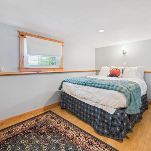 Bedroom 3: Cozy lower-level bedroom with a quiet, tucked-away feel