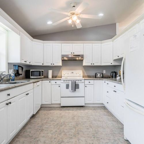 The kitchen is spacious and fully equipped with modern appliances, utensils, and cookware for your use.
