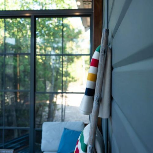 Cozy up with our signature blankets for cool evenings by the lake.