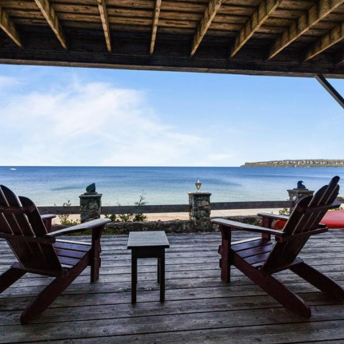 Sit back in Adirondack chairs on the covered patio and take in the expansive views of Georgian Bay, a perfect spot for peaceful reflection.
