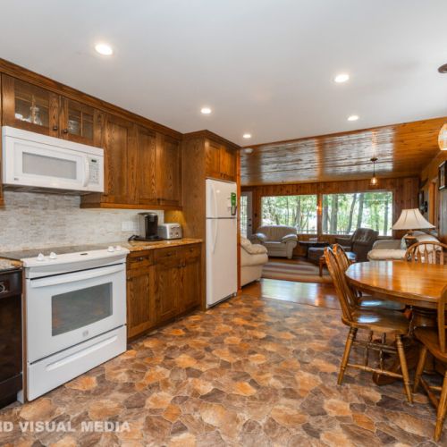 Spacious kitchen with full appliances and a bright dining area for shared meals and family time.