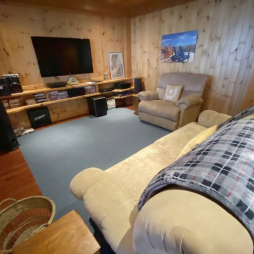 Enjoy a cozy space for relaxation and entertainment, complete with ample seating, a sound system, and a collection of movies to enhance your stay.
