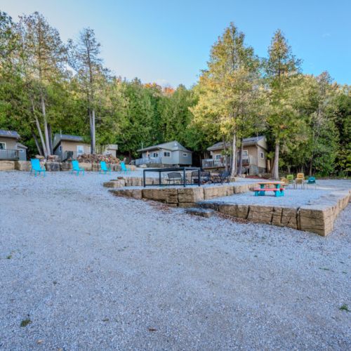 View of the fire pit and surrounding area with multiple seating options, encouraging guests to enjoy the outdoor ambiance.