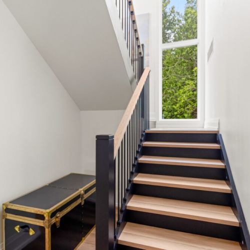 Bright, open stairways and large windows fill the home with natural light.