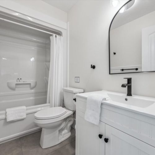 Enjoy a crisp, clean bathroom with sleek fixtures, full tub, and relaxing vibe—perfect for a post-hike refresh.