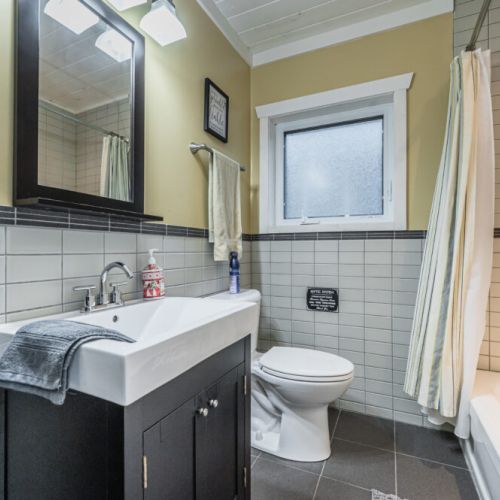 Bright bathroom with full tub and shower—perfect for unwinding after a day on the bay.