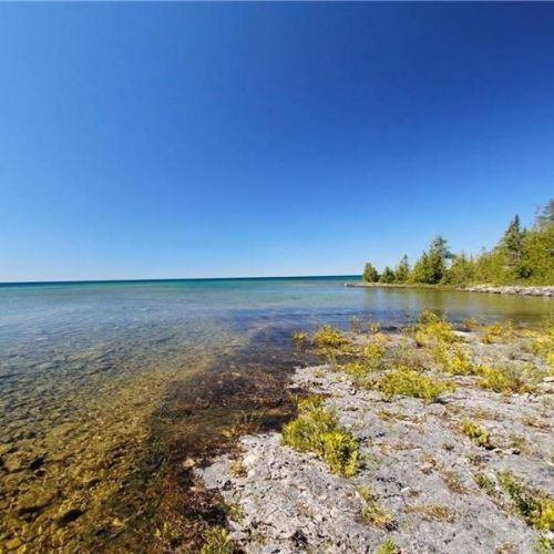 Crystal-clear water and rocky shoreline—great for swimming and exploring.