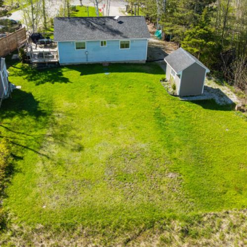 View of the spacious back lawn! Feel free to enjoy this space with the little ones.
