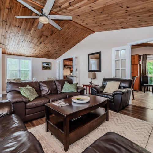 Gather around with loved ones in this cozy seating area, complete with plush couches and a welcoming atmosphere.