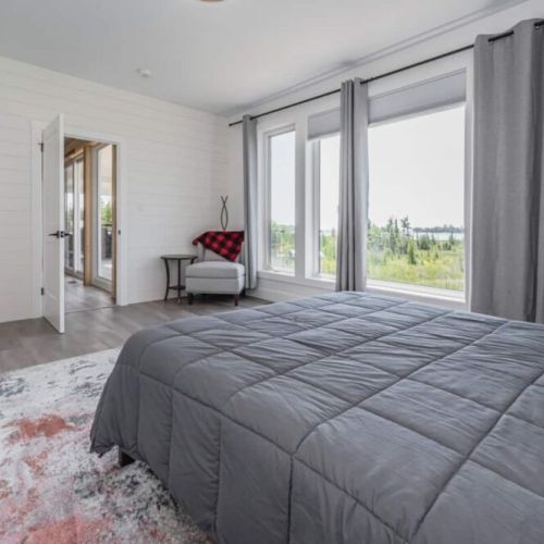 Another view of the King's suite with a view of the nature reserve and waterfront.