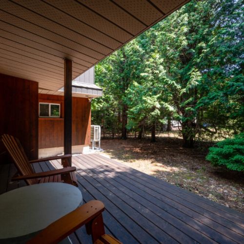 Lounge on the spacious deck that merges seamlessly with the forest backdrop, an ideal setting for afternoon revelries or evening soirees.