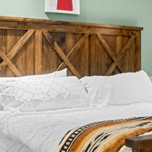 Thoughtfully furnished bedrooms provide a relaxing cottage retreat.