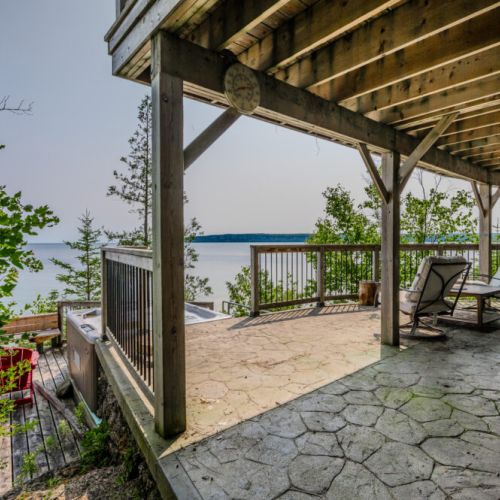 With multiple deck levels, there's ample space for entertaining or finding a quiet spot to unwind. The well-maintained outdoor areas enhance the overall appeal of the cottage.