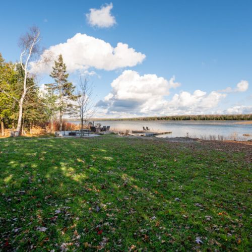 The expansive backyard offers ample space for a variety of outdoor activities. Whether it's a game of frisbee, a yoga session, or simply basking in the sun, there's room for everyone to enjoy their favorite pastimes.