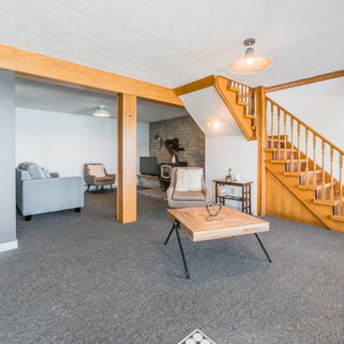 The layout is thoughtfully designed to cater to overnight guests and multi-generational families, with a walk-out basement featuring a private bathroom and living area, ensuring space and privacy for all.