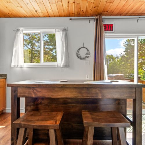 The kitchen island is the perfect spot for morning coffee or a quick meal.