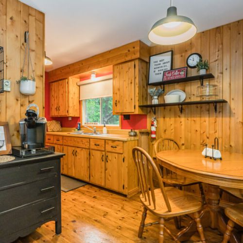 Step over to the kitchen and dining area, tucked away behind the living space.