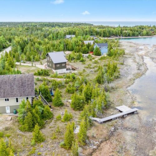 A view of the dock and boardwalk from above shows the perfect spot for launching kayaks, wildlife watching, or quiet reflection.