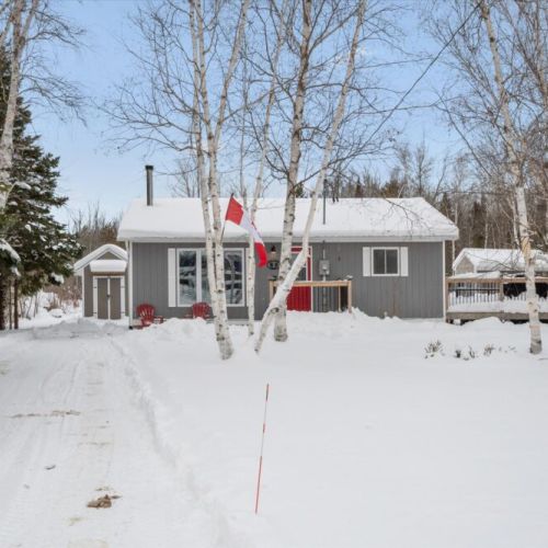 Miller Lake Maple Retreat in winter — a cozy, modern cottage tucked into the peaceful Bruce Peninsula landscape.