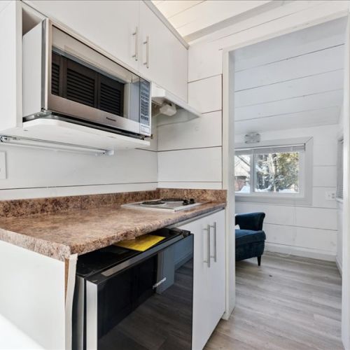 Compact kitchenette area with everything you need for easy meals and snacks during your stay. Clean finishes, great lighting, and a convenient layout.