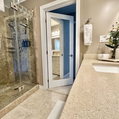 Walk-in glass shower featuring dual shower heads for a spa-like experience.