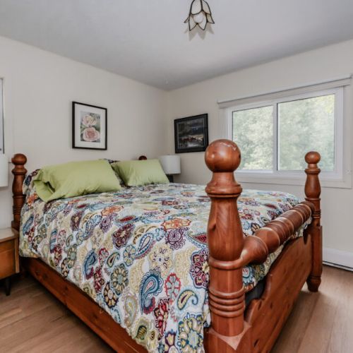 The second guest bedroom offers a cozy and inviting atmosphere, complete with a comfortable bed and charming furnishings.