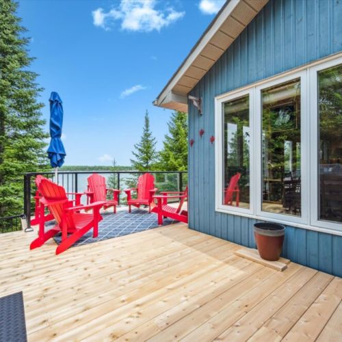 Grill up a summer feast and take in the treetop and bay views from the elevated lakeside deck.