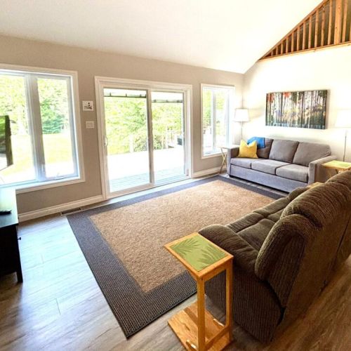 Kick back and unwind—this cozy lounge area features reclining comfort, plenty of seating, and a corner TV for movie nights in.