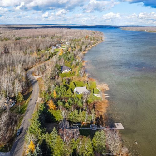 Take a bird's-eye view of the expansive backyard, revealing a harmonious symphony of space, serenity, and recreational delights.