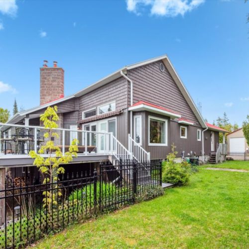 From morning sunshine to nighttime stargazing, the expansive backyard offers privacy, greenery, and the gentle breezes of Lake Huron—plus direct access to the gazebo and hot tub pavilion.