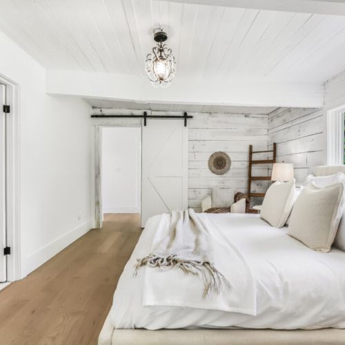 Clean airy bedroom with charming details and lots of room to unpack and unwind.