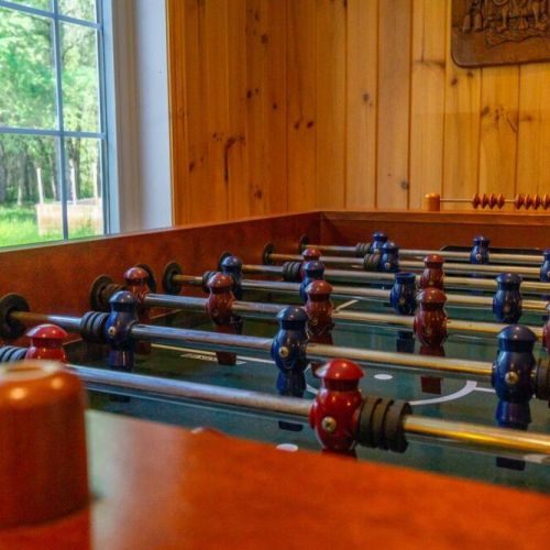 Foosball fun awaits! This vacation home offers classic entertainment for all ages in a rustic, cozy setting with scenic window views