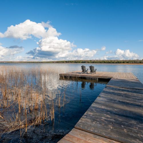 Wander towards the wooden dock and be welcomed by a tranquil escape. The dock extends over the water, providing a front-row seat to the serenity that surrounds you.
