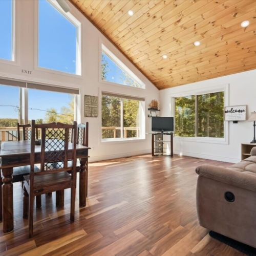 Relax in the spacious great room where comfortable seating and panoramic windows create the perfect place to unwind.