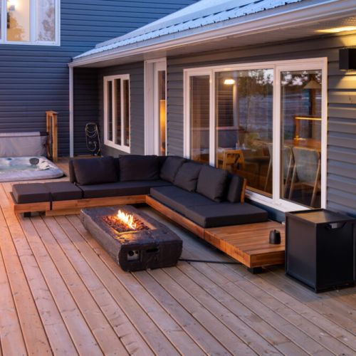 Unforgettable Outdoor Experiences: Create unforgettable memories on this spacious deck. The comfortable seating, fire pit with wind shield, and hot tub offer everything you need for entertaining and enjoying the beautiful outdoors.