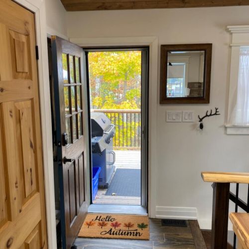 Direct access to one of 3 decks. This one leads straight to the picnic table and propane bbq during your stay.