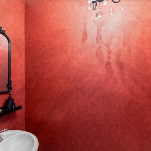A warm and inviting bathroom with distinctive finishes and plenty of character.