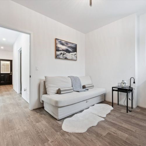 A cozy secondary living space that works beautifully as a lounge, reading nook, or additional sleeping area.