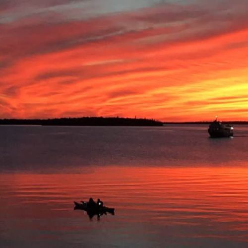 An unforgettable evening view—watch the sky ignite with deep reds and fiery oranges as canoeists drift peacefully across the glowing water. This is nature’s theatre, and your private deck is the best seat in the house.