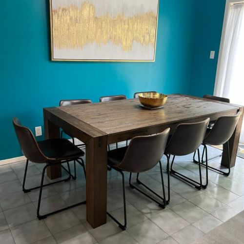 A bright and inviting dining area, perfect for family meals and gatherings, with natural light flooding in through the windows.