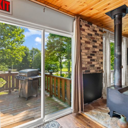 Step outside to the wraparound deck and enjoy peaceful views toward Miller Lake.