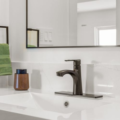 A bright, modern bathroom with stylish finishes and plenty of counter space.