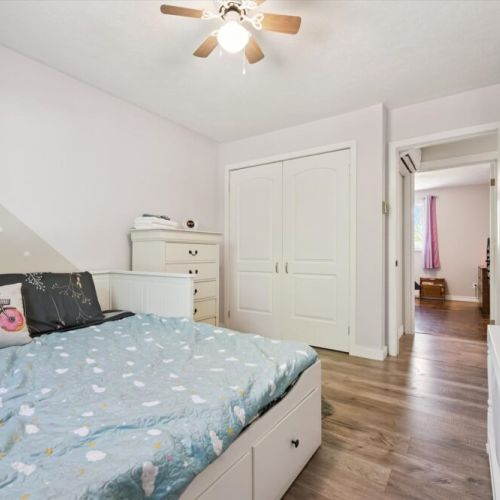 Bedroom 3: Bright and comfortable bedroom featuring a cozy bed, ample storage, and easy access to the main living areas.