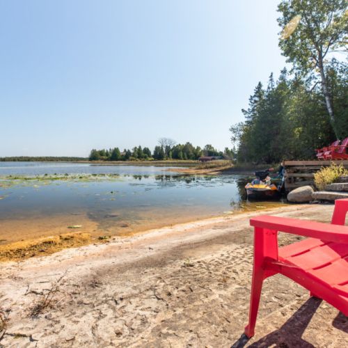 Sandy shoreline area for wading lounging and enjoying the bayside setting.