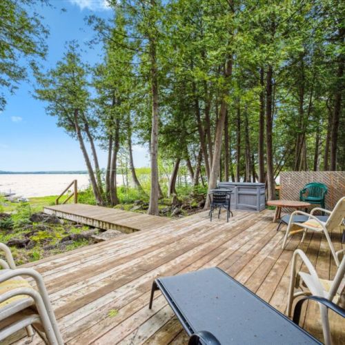 The large lakeside deck is your outdoor living room—ideal for sunbathing, dining al fresco, or just soaking up the views of Berford Lake.