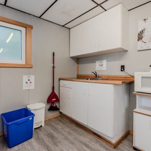 Additional kitchen amenities include a microwave and ample storage space for convenience during your stay.